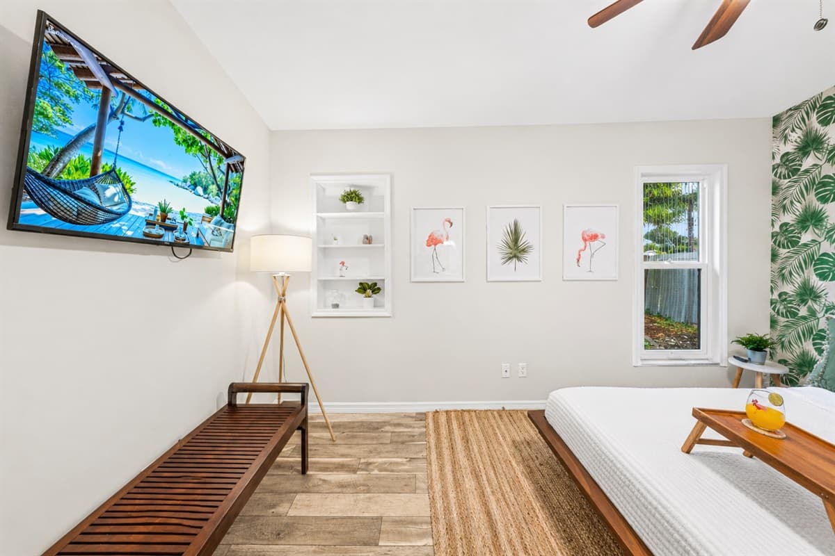 Coastal-inspired artwork brings a bright, tropical vibe to the space.