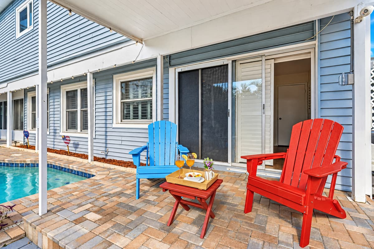 Poolside seating area just steps from the water—ideal for lounging and enjoying the outdoors 