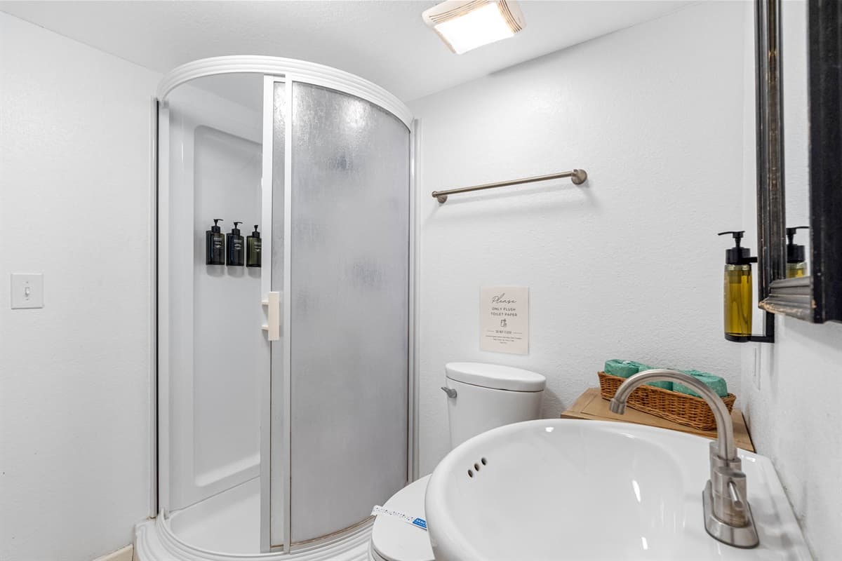 The modern walk-in shower, contemporary fixtures, and thoughtful design elements work together to create a bathroom that meets your needs and enhances your overall experience.