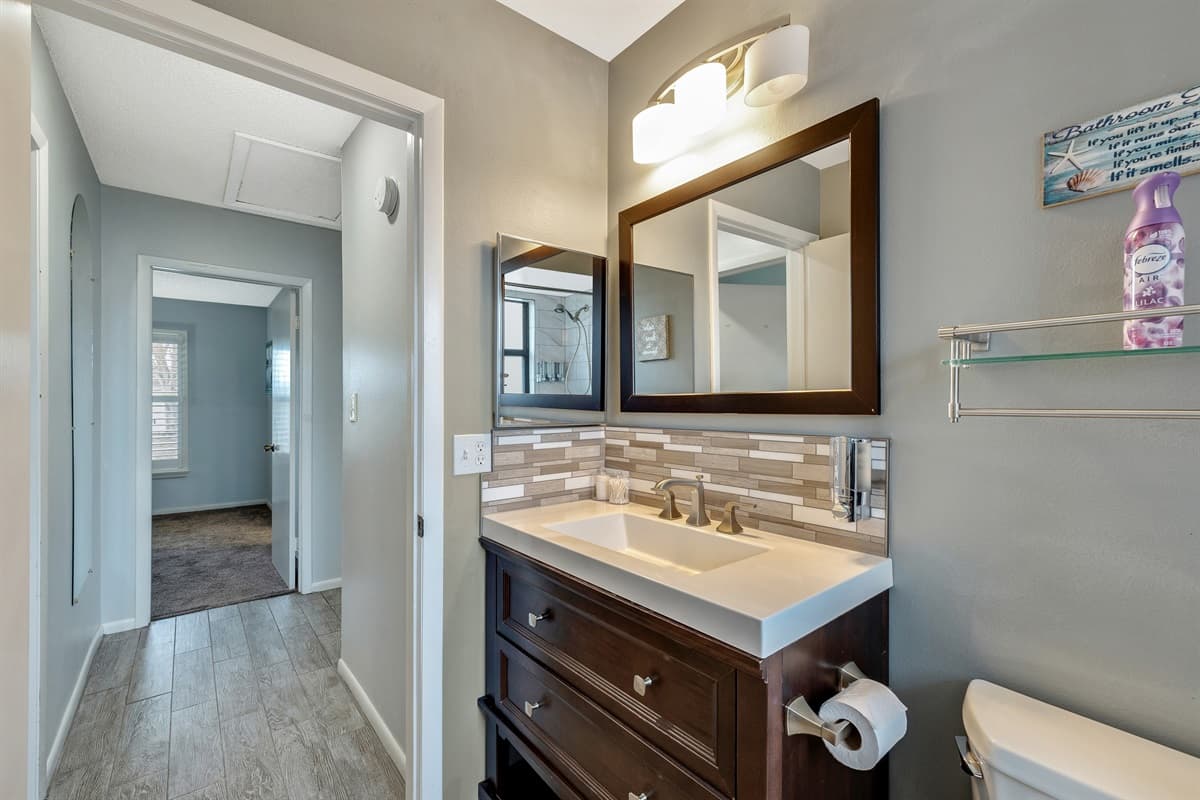 The design of the full bathroom is a symphony of style and functionality, featuring contemporary fixtures and tasteful decor that create an inviting atmosphere.