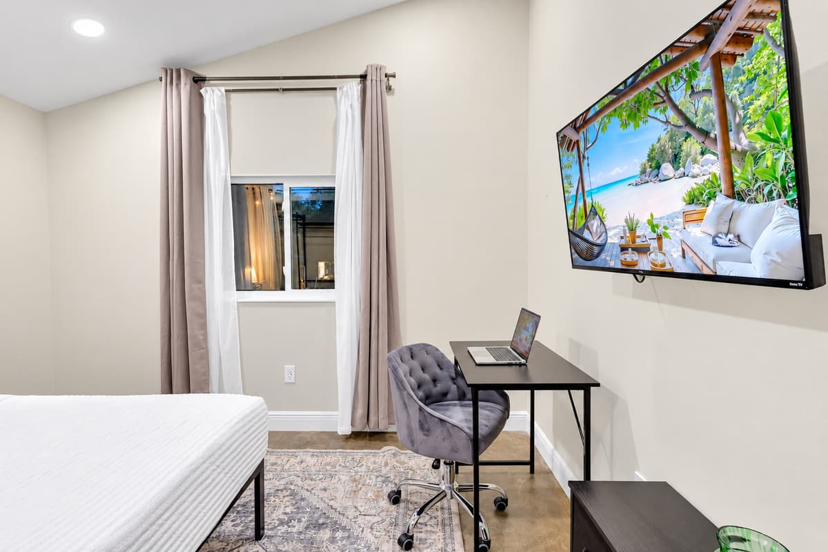 Close the door, take the call, then take the day off. A private room with a workspace and a smart TV, tucked far enough from the pool that no one hears the meeting.