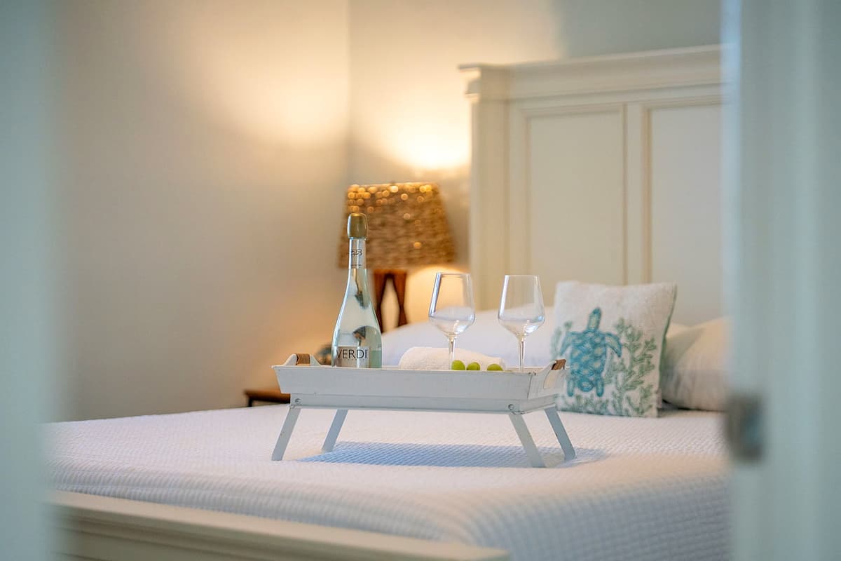 A well-placed nightstand with soft lighting offers convenience for evening reading or relaxation.