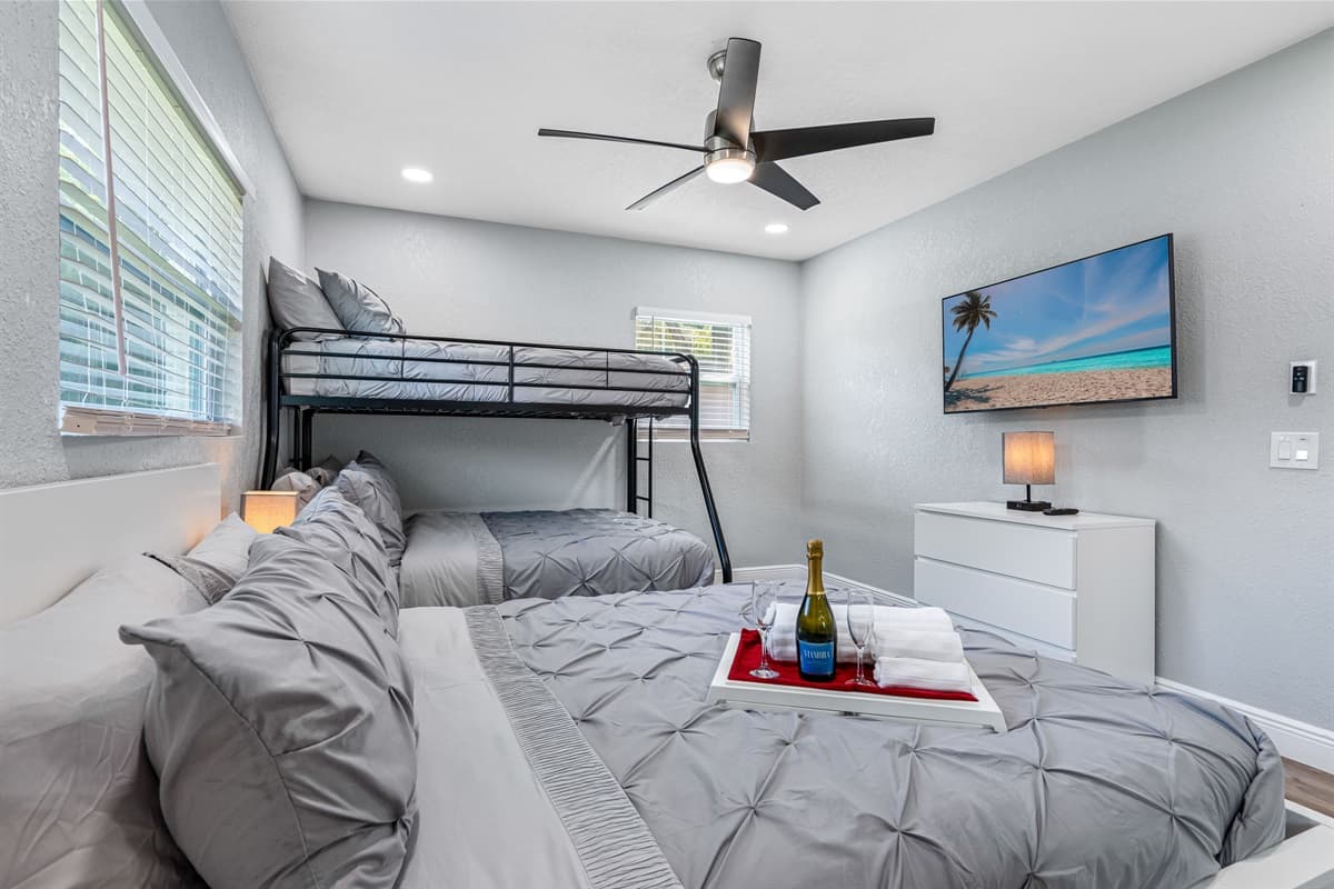 Bunkbed and a double size bed for a small family or a group of friends who wants to hang out and sleep in one room. It is very spacious and has its own smart TV. 