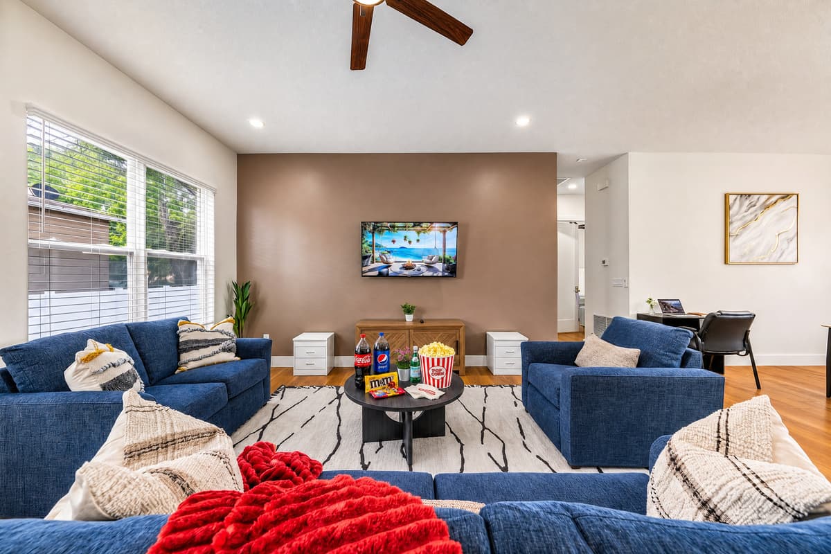 Sink into the plush sectional sofa — perfect for movie nights or relaxing after a day of exploring.