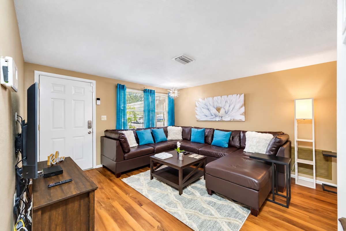 Modern living room equipped with a large flat-screen smart TV that will stream Netflix, HBO, YoutubeTV, and others. If you have any questions at all, please send us an inquiry today!