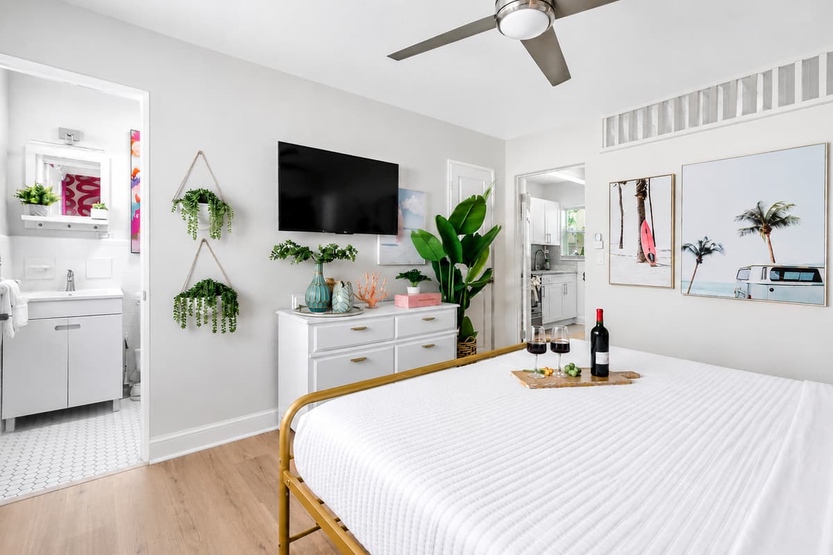 Wake up refreshed in the bright king bedroom with convenient access to the bathroom, Smart TV, and plenty of storage for longer stays.