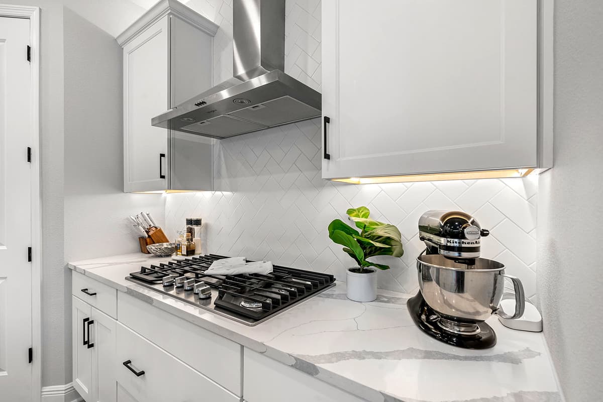 Smooth granite countertops stretch elegantly across the space.