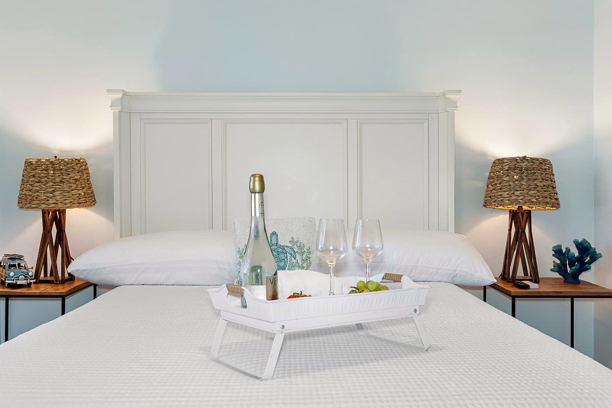 The bedroom features a queen-size bed, outfitted with soft, high-quality linens that promise a restful night’s sleep.
