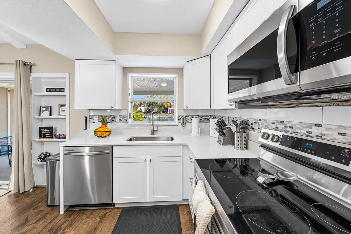 Modern kitchen layout with premium appliances and an open flow into the dining area.