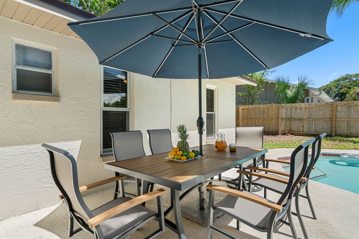 For those who enjoy dining al fresco, the pool area features a charming patio equipped with outdoor seating.