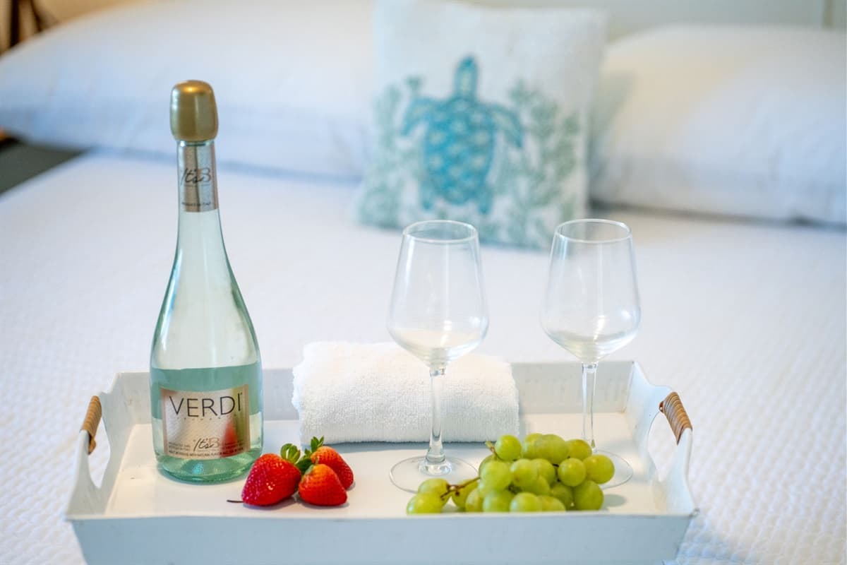 This bedroom features a comfortable double bed, dressed in soft, high-quality linens to ensure a restful sleep.