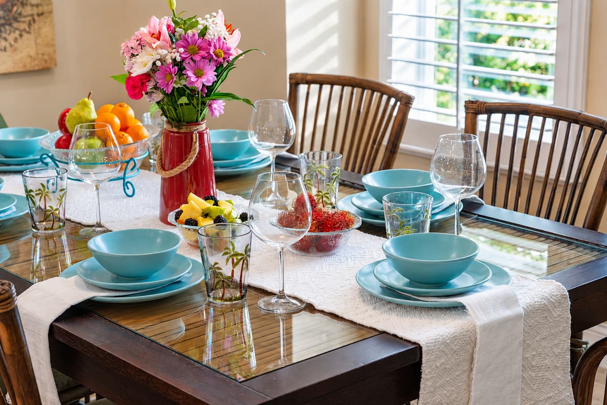 Enjoy delicious meals in this beautifully set dining area, surrounded by natural light and coastal charm.