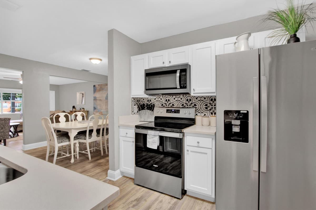 Stainless steel gleams, countertops beckon, and a symphony of modern conveniences awaits your every culinary whim.