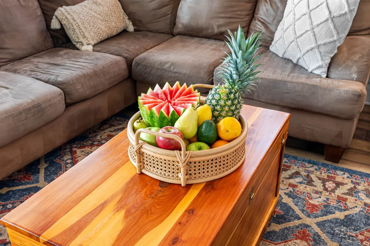 A central coffee table complements the seating, offering a perfect spot for snacks, drinks, or displaying decorative accents that add a touch of charm to the room.
