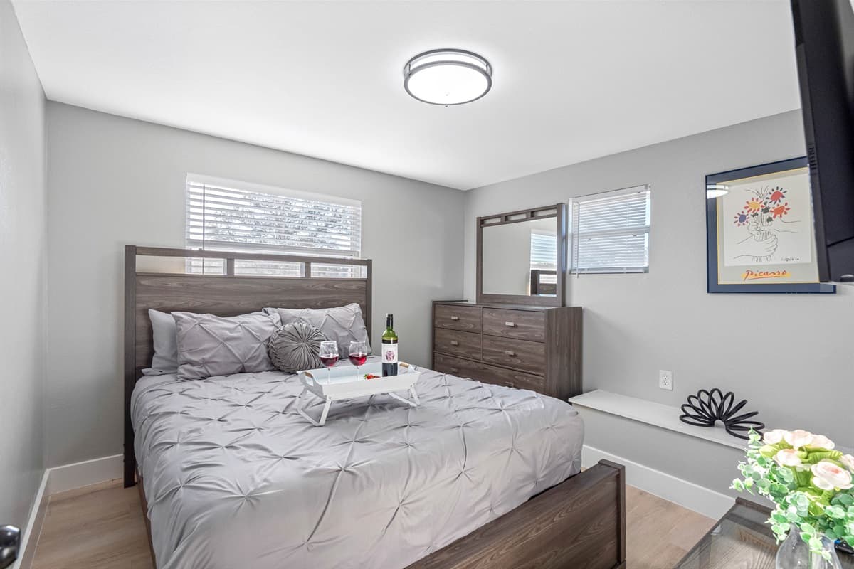 Experience the charm of our lovely bedroom featuring a supremely comfortable queen-size bed and an elegant decor.