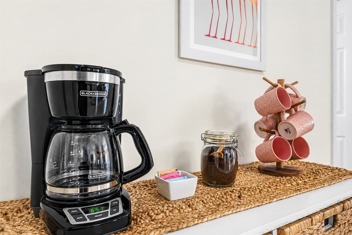 Coffee station with drip coffee maker and mugs for your morning routine.