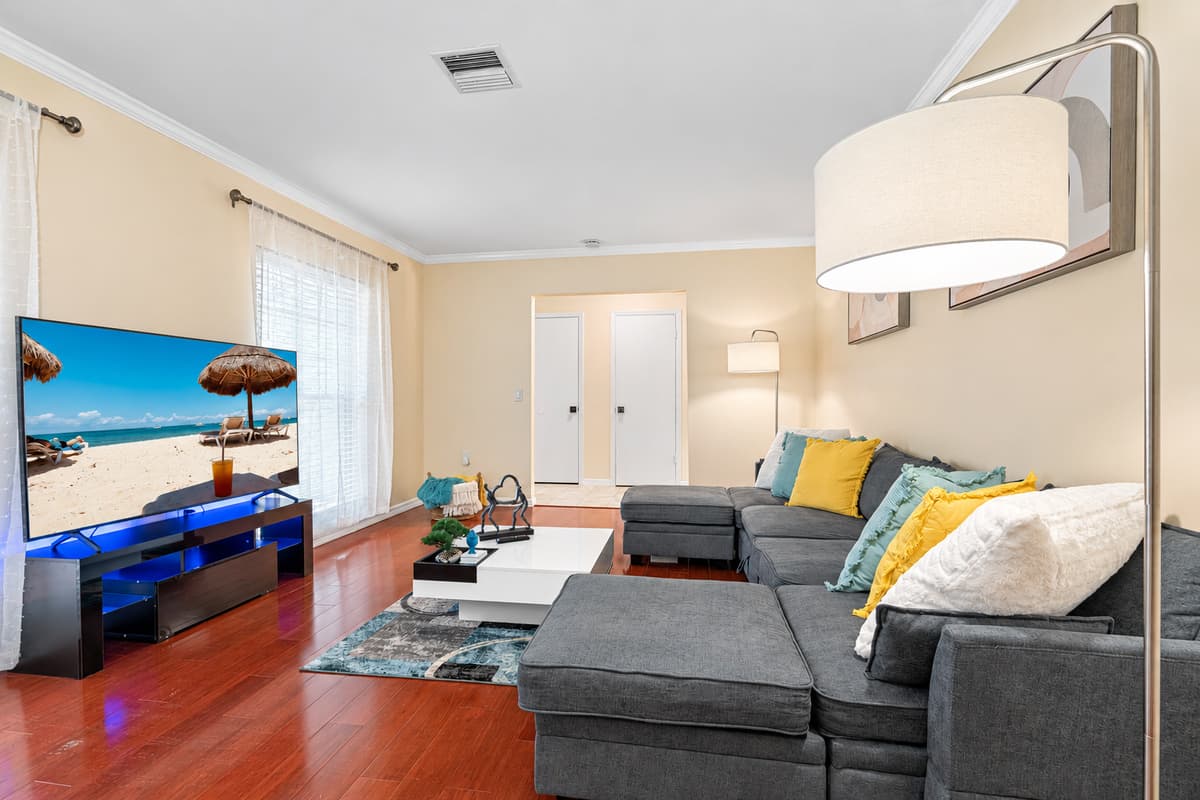 Sink into the plush cushions of the oversized sofa, with light and warm colored plush pillows.