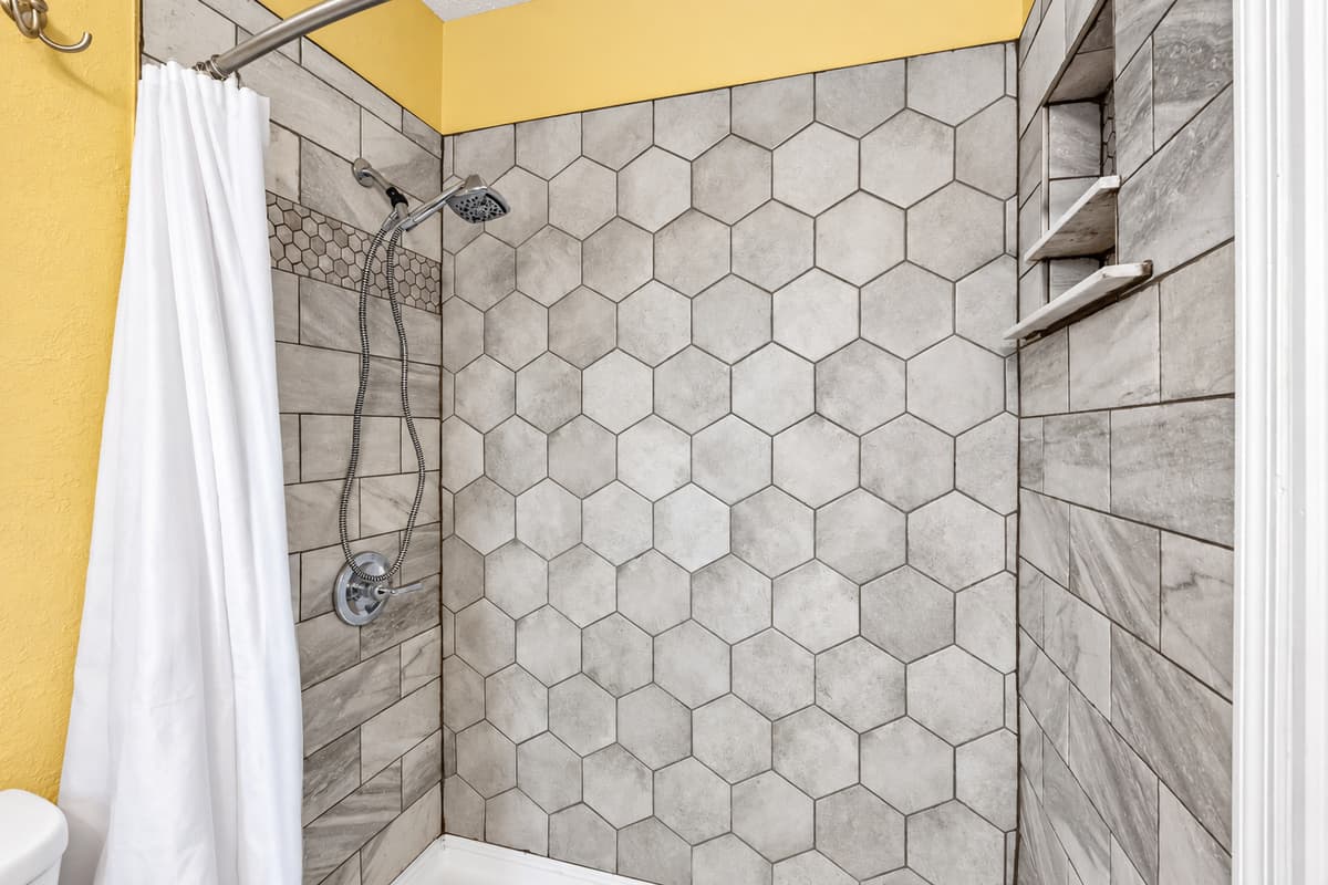 Modern bathroom featuring a sleek walk-in shower with stylish tile finishes.