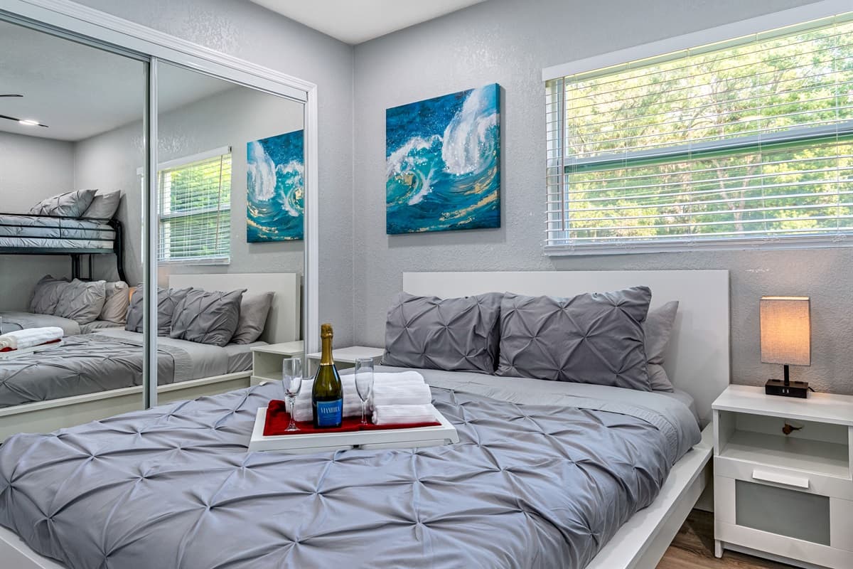 Lovely bedroom with a comfortable double sized bed and a bunk bed. This room also has its TV and a full length mirror closet. Have the best time with loved ones here! Send us a message if you have any questions regarding the property!