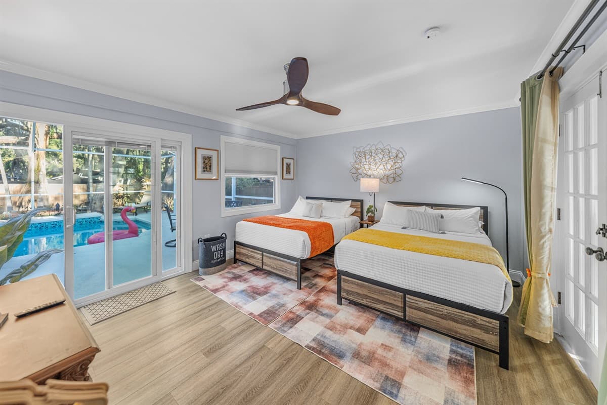 This spacious bedroom features two comfortable double beds, making it ideal for families, kids, or friends traveling together.