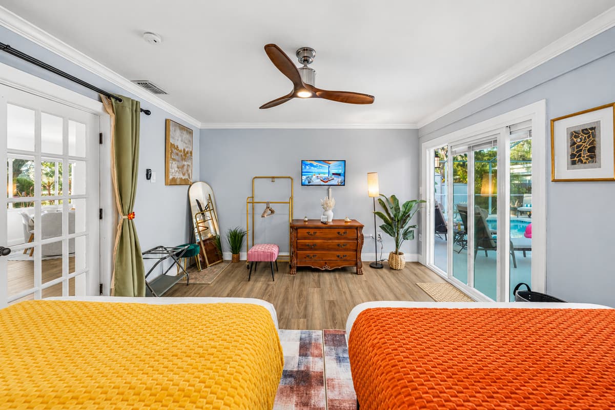 Designed for convenience and comfort, this bedroom includes two double beds in a clean, modern setting.