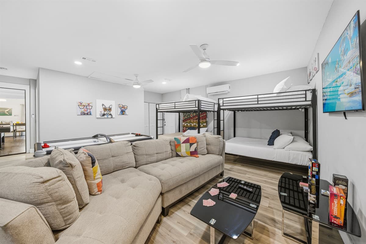 Spacious entertainment room designed for movie nights, games, and group fun.