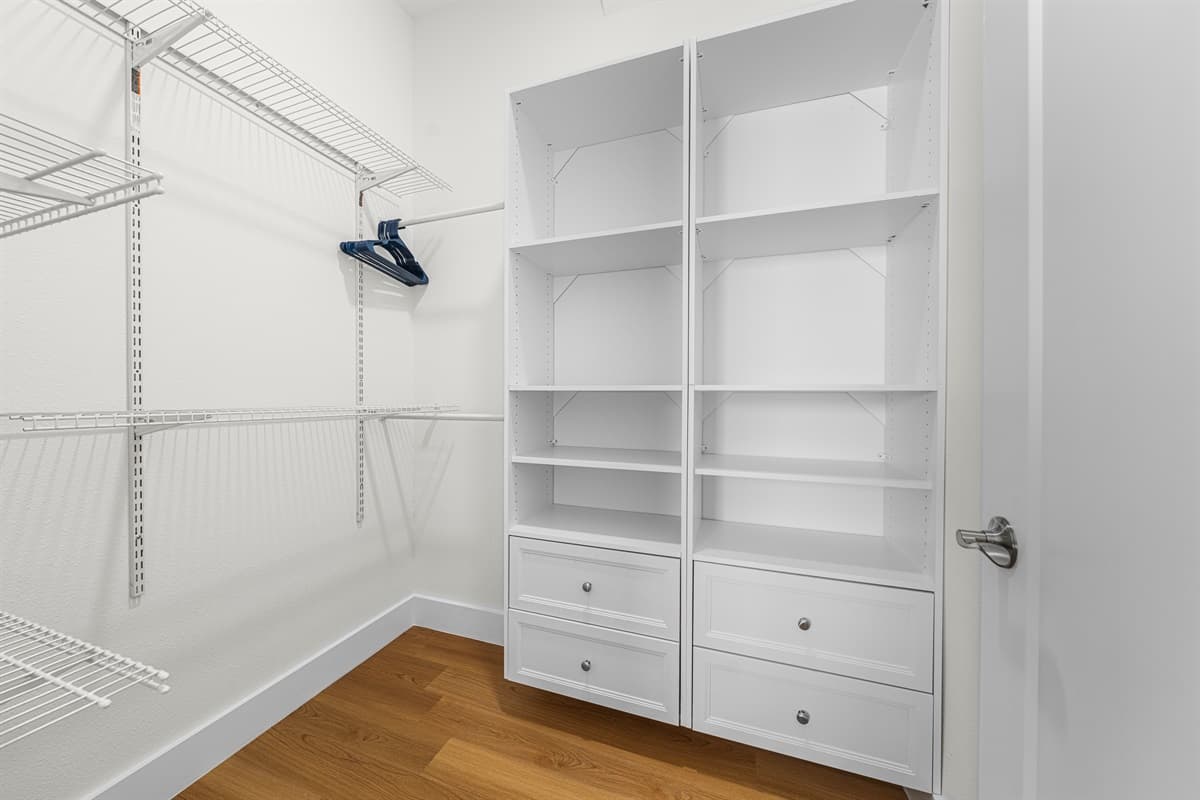 Generous closet space with built-in shelving and hangers — unpack and settle in like it's your own home.