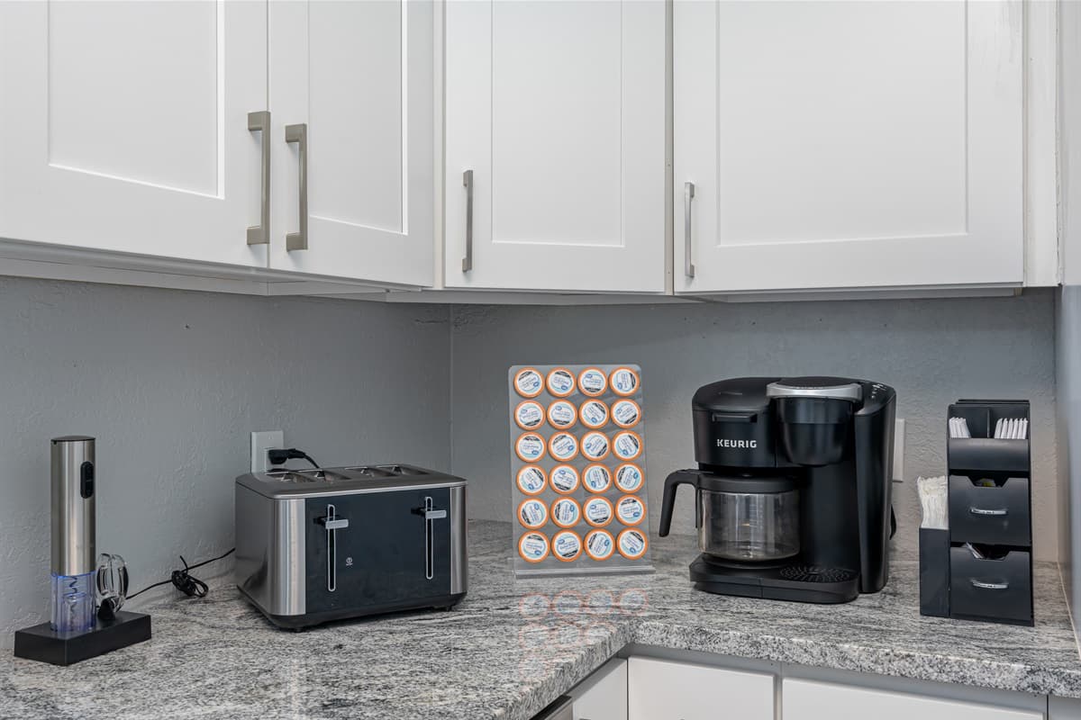 . The bright white cabinets and cupboards provide a clean and fresh look.