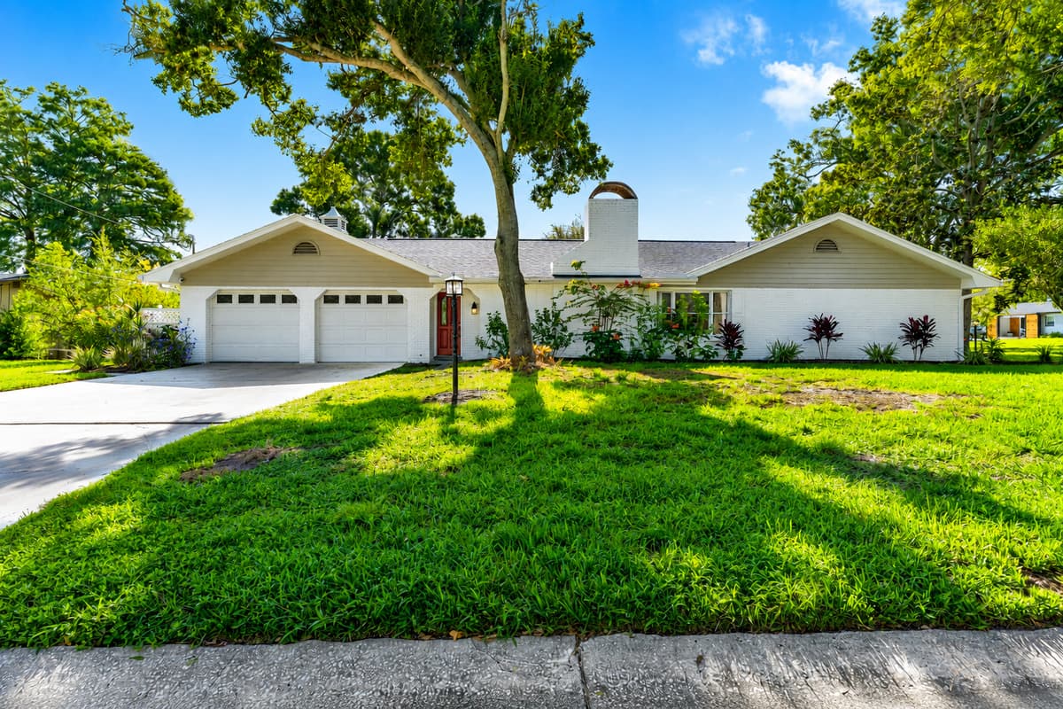 Corner lot with lawn on every side. The nearest neighbor isn't sharing a wall with you.
