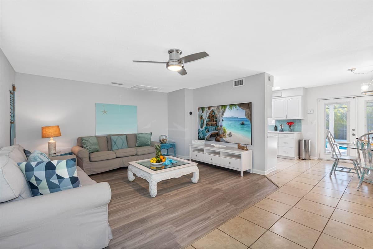 The soothing color palette and beach-themed décor immediately create a calm and welcoming atmosphere.