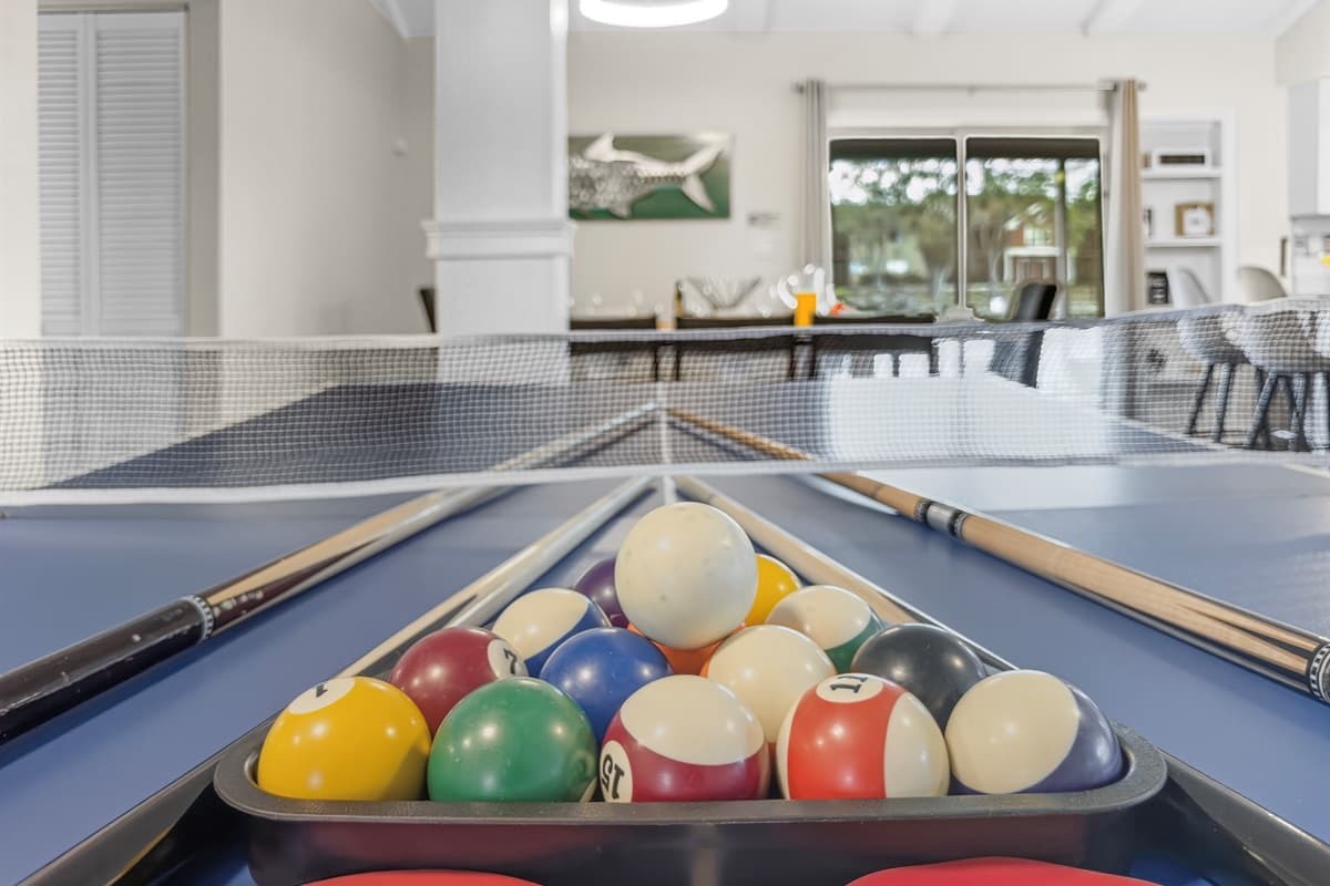 Pool table and open-concept layout create the perfect setting for memorable group getaways.