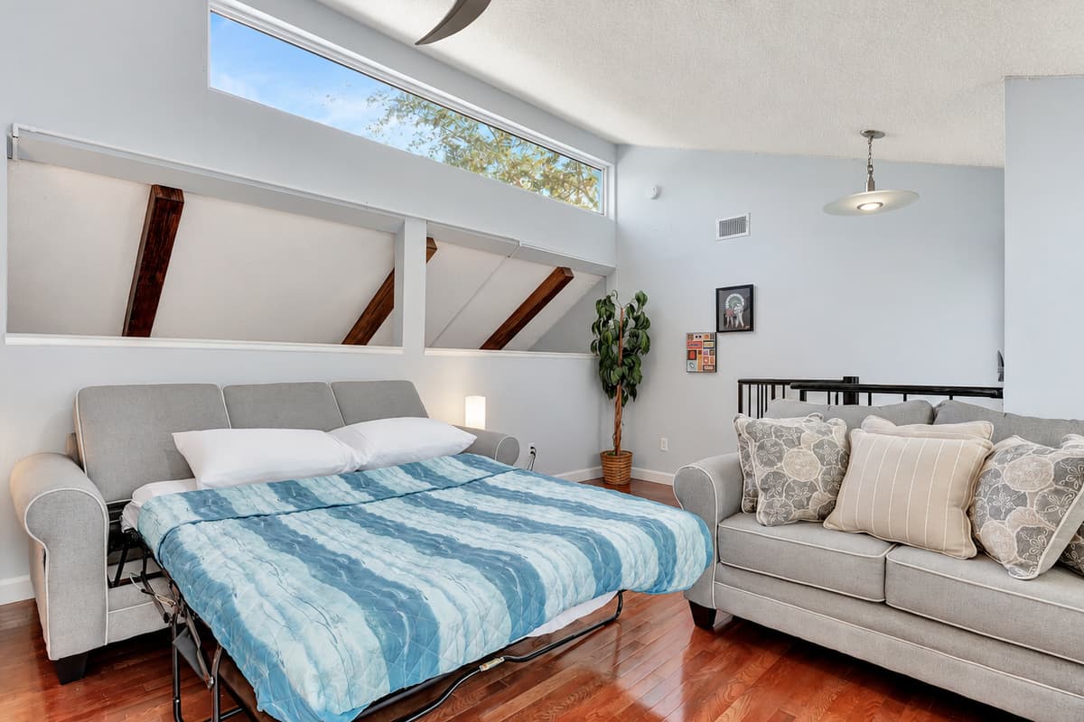 Escape to ultimate relaxation in our cozy bedroom retreat, where the luxury of comfort meets the practicality of a sleeper sofa.