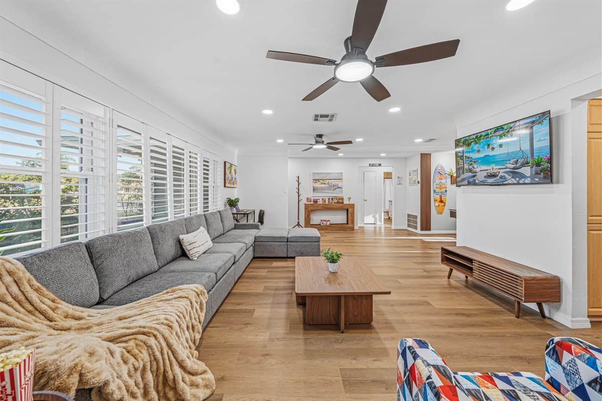 Expansive living space with oversized sectional and open layout—ideal for group comfort and connection 