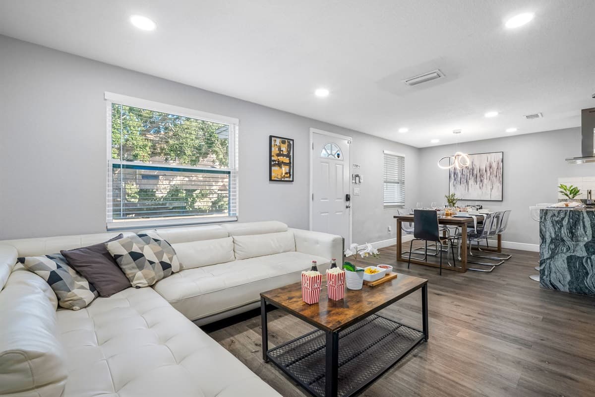 With sleek décor, a large sofa, and classic board games, this space is designed for both relaxation and entertainment.