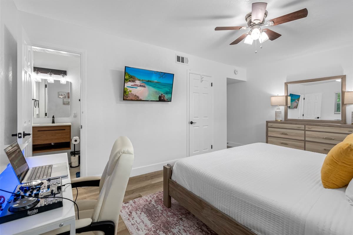 Designed for comfort and productivity, this stylish bedroom offers a plush bed, soft linens, and a dedicated workstation for remote work or planning beach adventures.