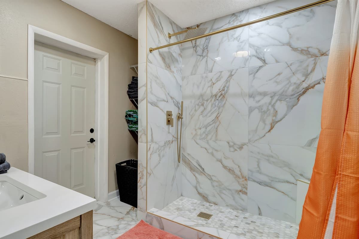 Enjoy the refreshing experience of a walk-in shower, promising both style and comfort in your daily routine.