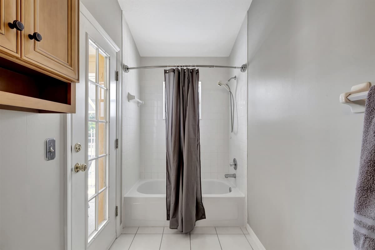 Whether you choose a leisurely soak in the tub, a revitalizing shower, or a moment of self-care at the vanity, this space promises to elevate your bathing experience to new heights.