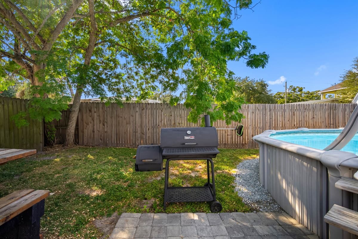 Fire up the grill and make lasting memories in this beautiful, open-air backyard.
