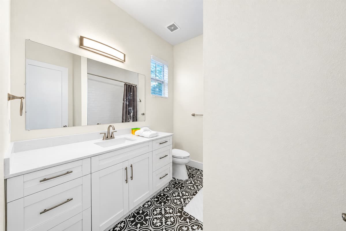 Double vanity bathroom with ample space and contemporary design.