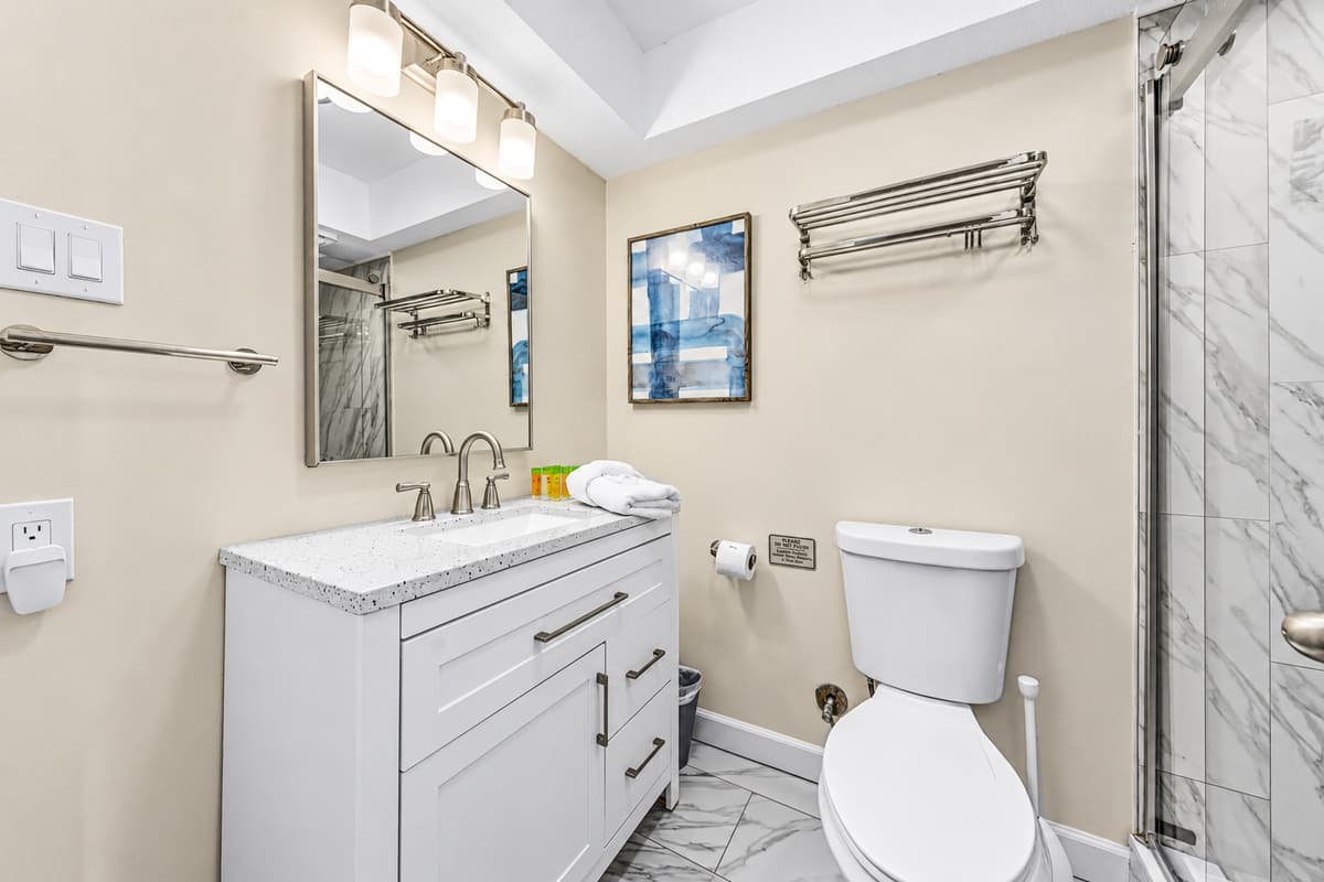 Fresh and stylish full bathroom stocked with essentials for your stay.