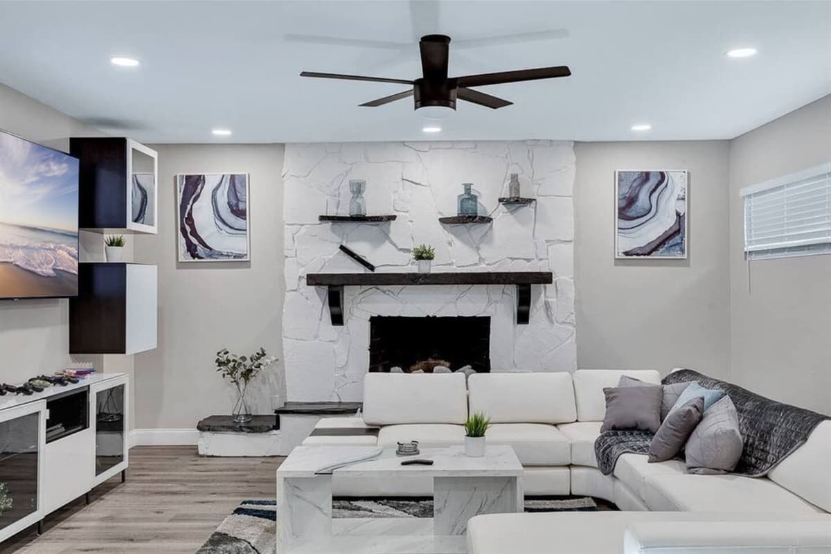 Spacious living room with a beautiful L-Shaped couch where you and your family and friends can bond and relax. 