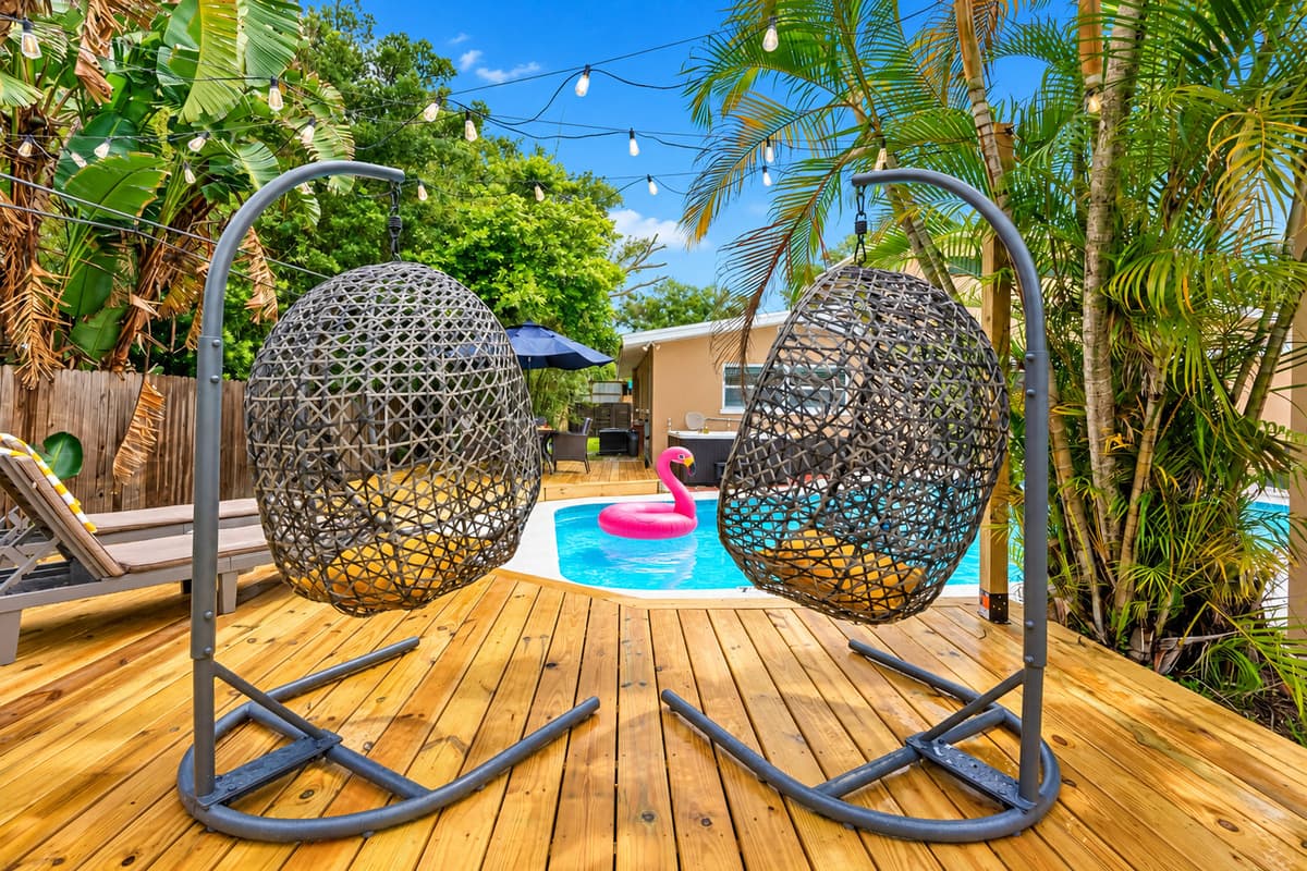 Whether you're sunbathing or stargazing, this tropical-inspired pool deck delivers all the island vibes.