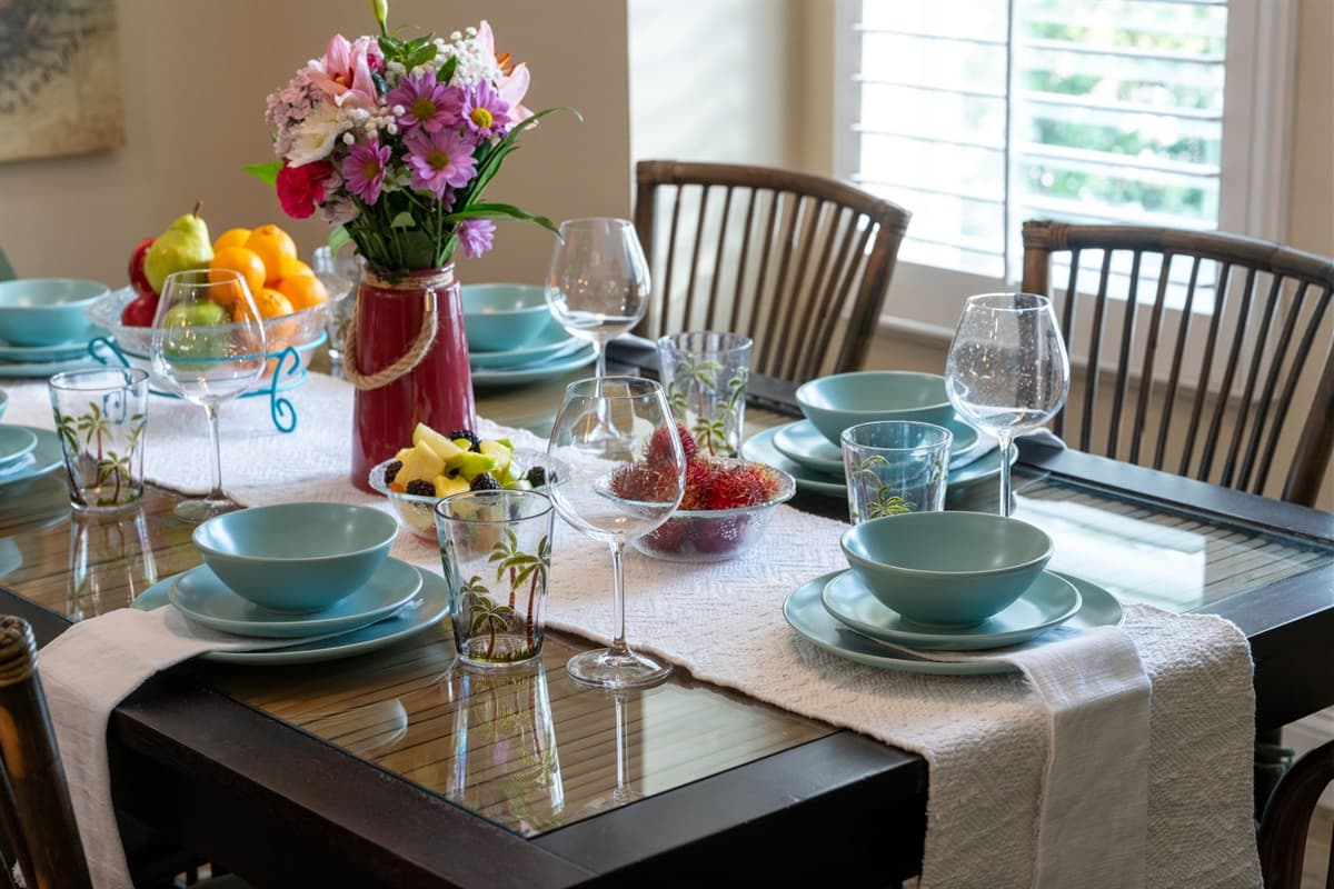 Enjoy delicious meals in this beautifully set dining area, surrounded by natural light and coastal charm.