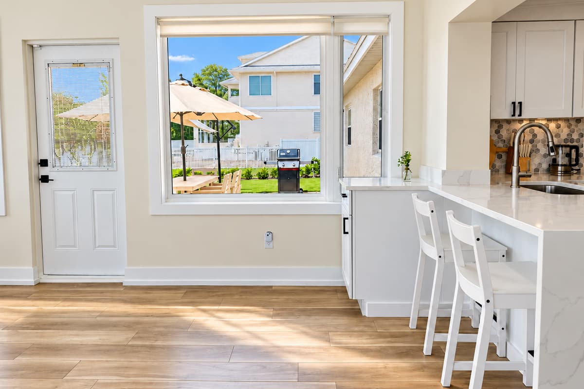 Open desk nook beside the waterfront living and dining space.