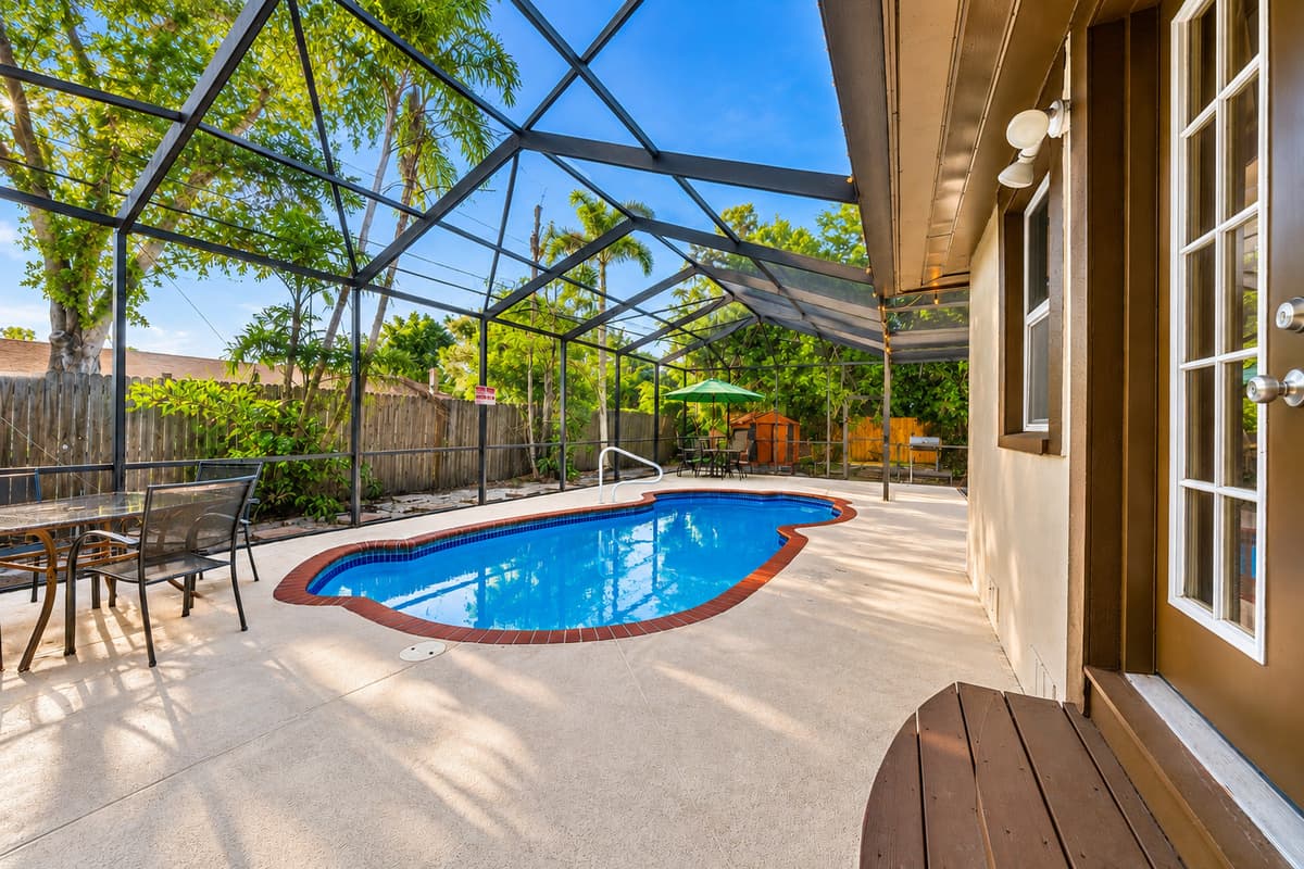 Bright poolside view with easy access to the patio and outdoor entertainment spaces.