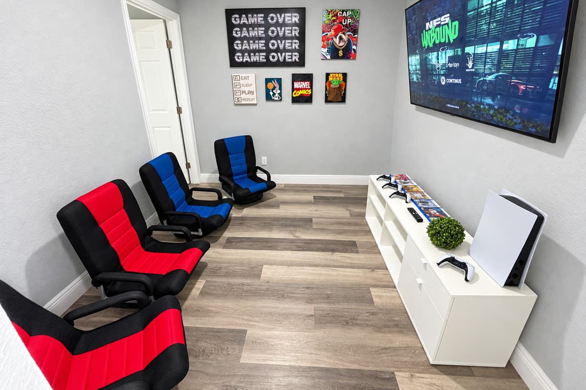 The game room the kids won't want to leave. A PlayStation 5, four controllers, a big Smart TV, and gaming rockers. Rainy afternoon or post-pool downtime, the kids have their own space and the adults get some peace.