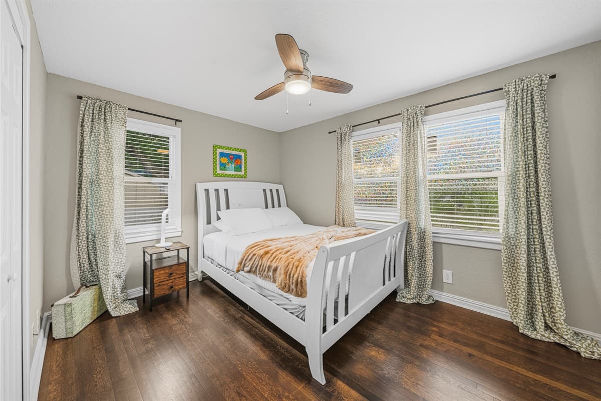 Cozy bedroom with natural light, comfortable bed, and calming decor for a restful night’s sleep.