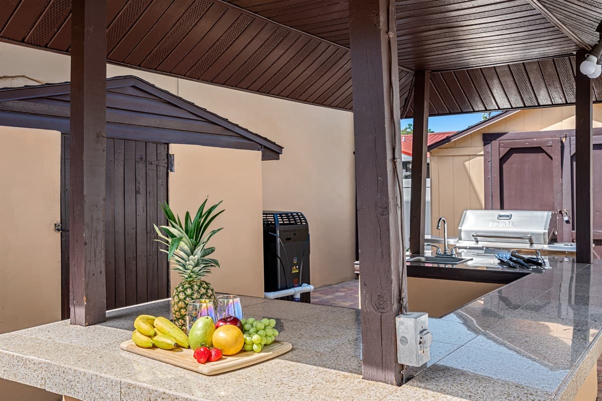 Our outdoor grilling station features top-of-the-line grills, smokers, and other cooking equipment, as well as ample counter space and storage for all your cooking essentials.