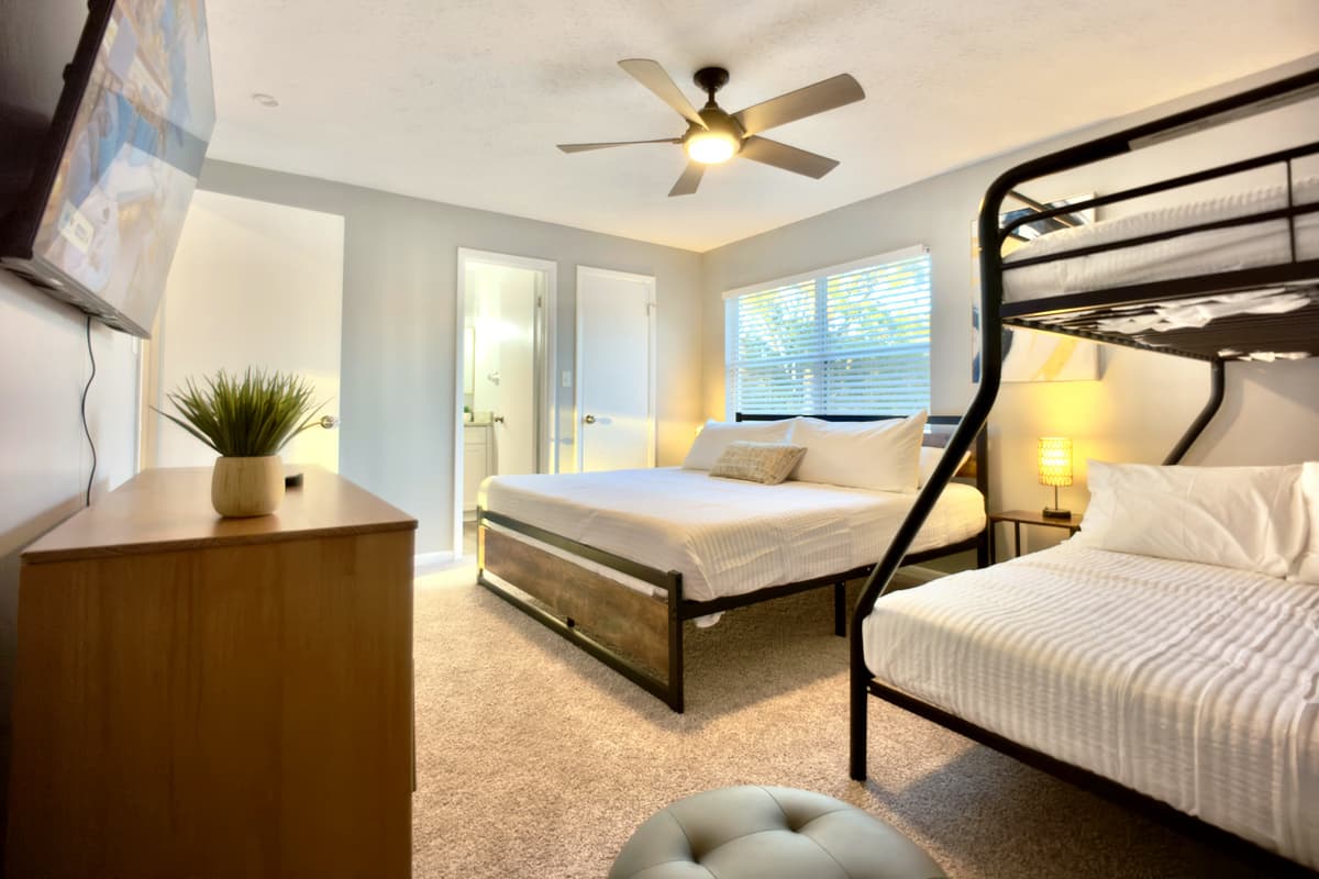 This bedroom offers a comfortable and flexible sleeping arrangement for families or groups.