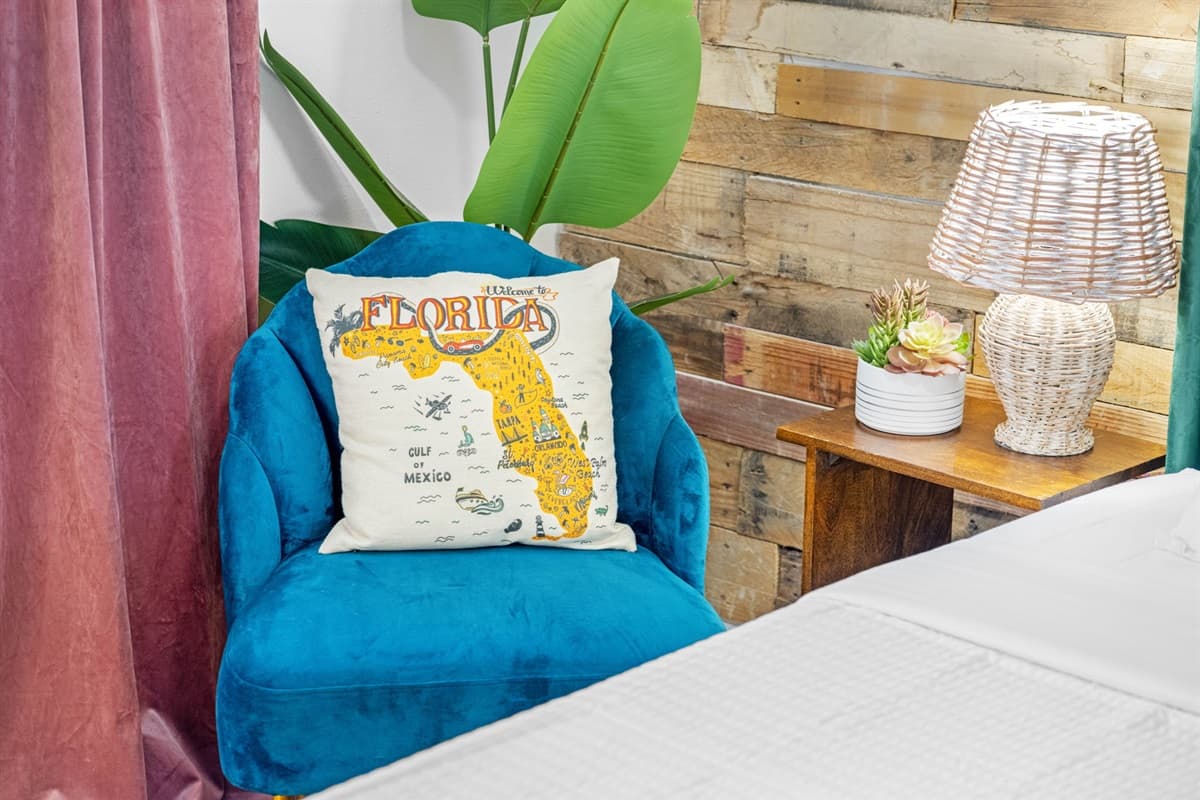 Beside the bed, stylish nightstands hold soft-glow lamps, allowing you to set the perfect ambiance for a relaxing evening.